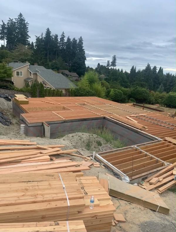 Foundation walls and floor joist framing on a hillside lot