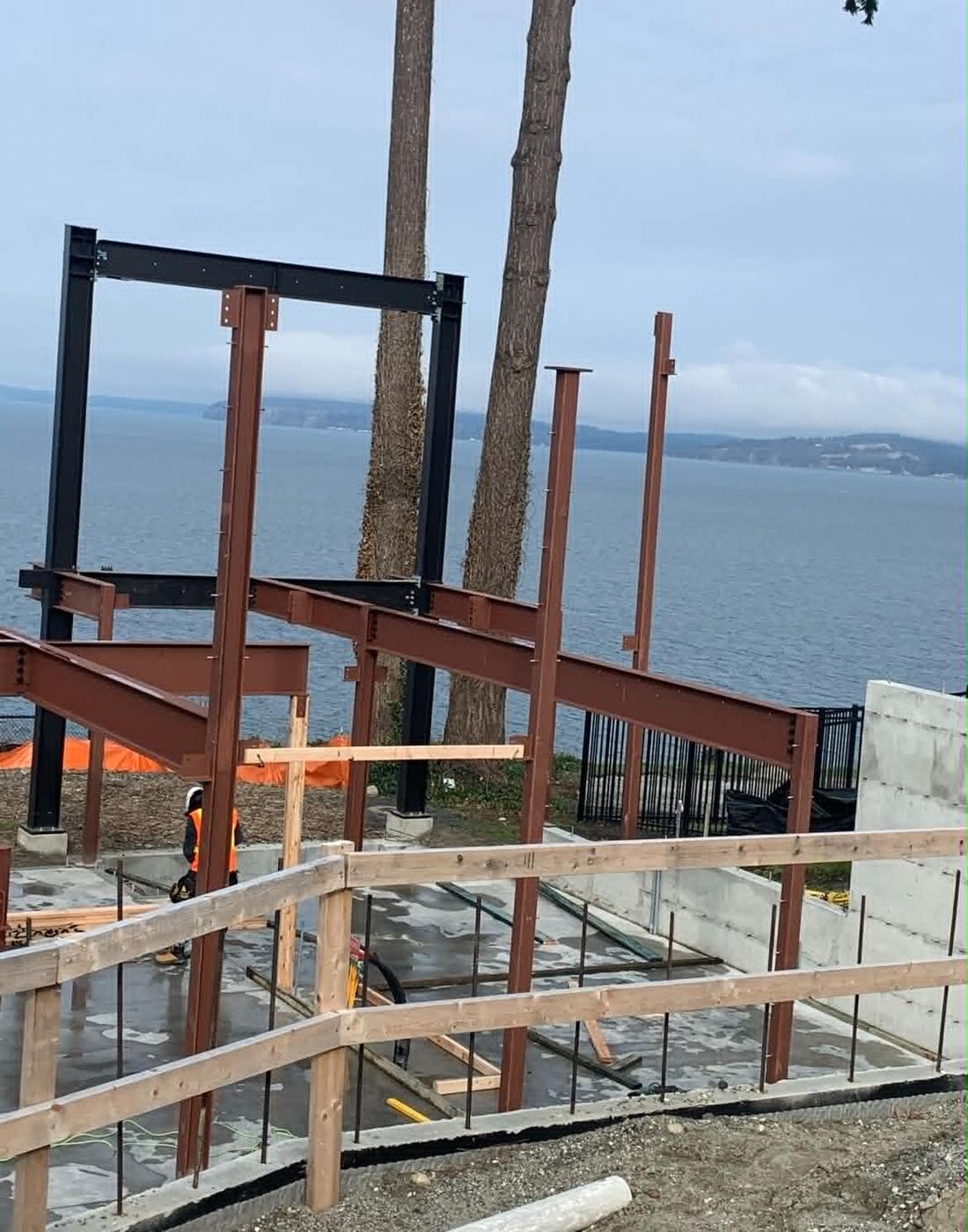 Steel beam frame erected for a custom waterfront home overlooking Puget Sound, Washington